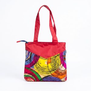 Sherry Bag with colourful Kitenge pattern and polyester fabric, red handles and spacious tote design